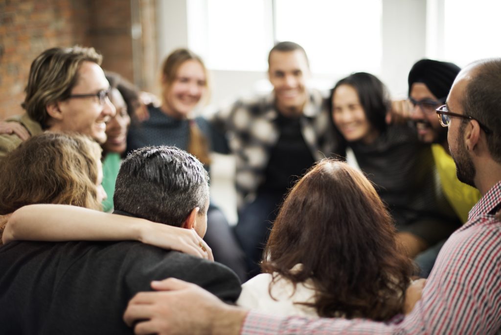 Community team doing a group hug